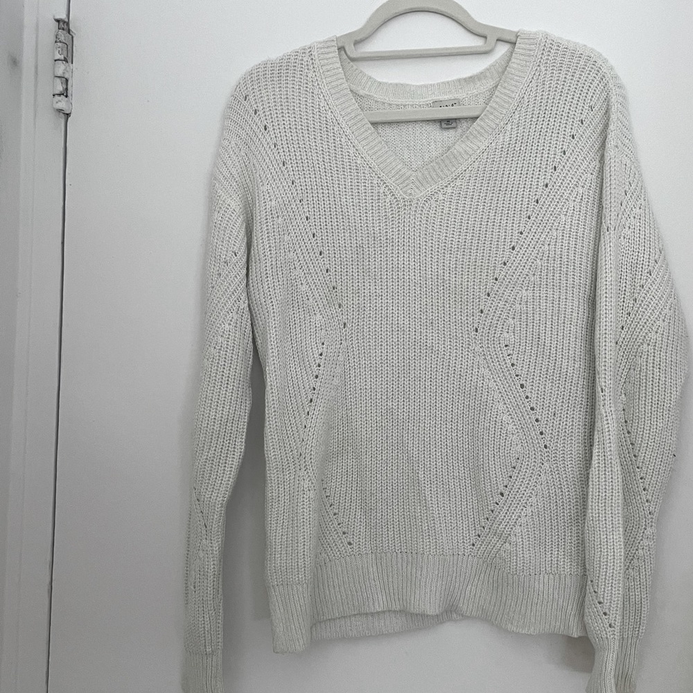 A New York Day brand white v neck sweater